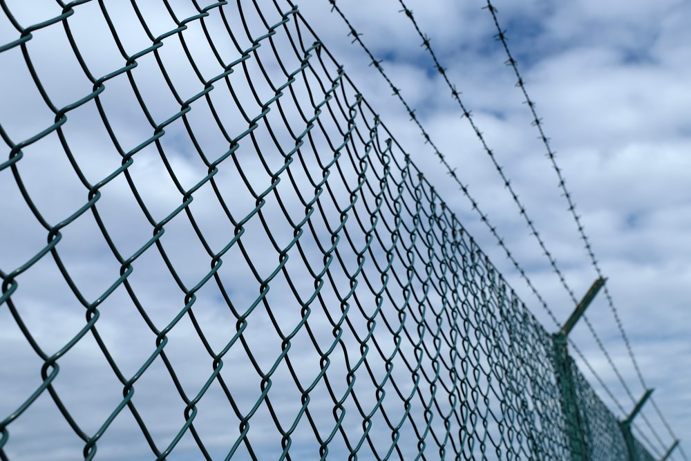 Chain Link with Barbed Wire Topping